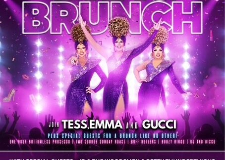 Three drag queens pose on stage with pink lighting and spotlights; event text at the bottom.